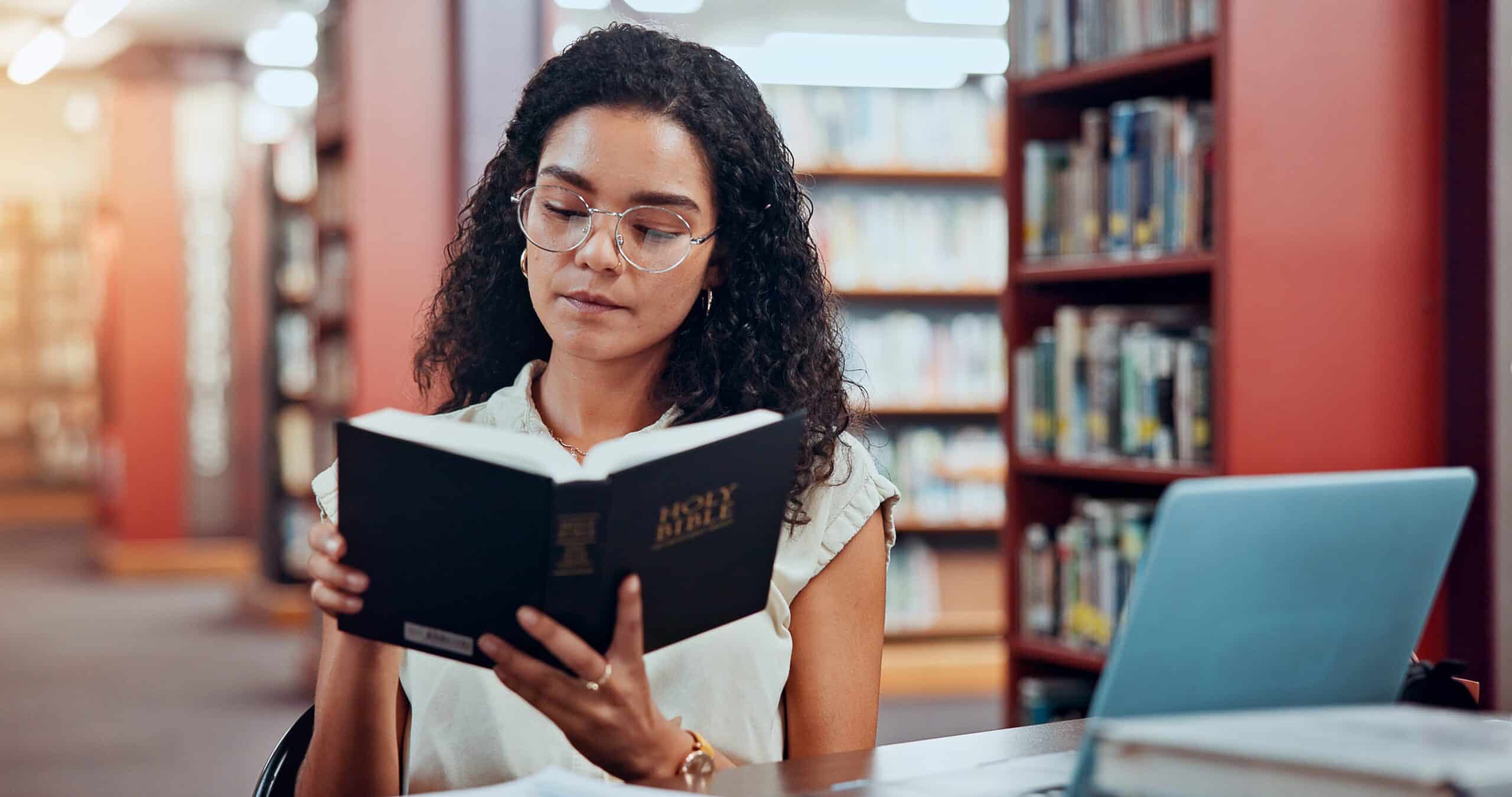 Women reading the Holy Bible in a ministry setting