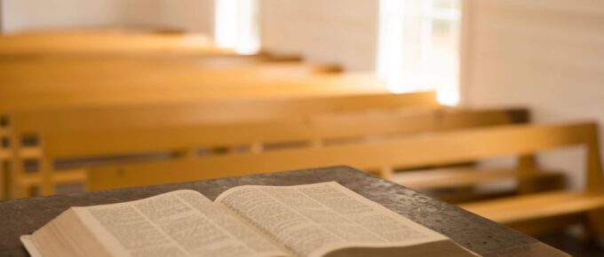 Open Bible laying on a podium in a church setting