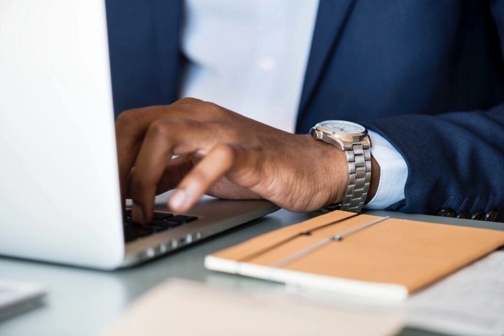 Influencer typing on laptio