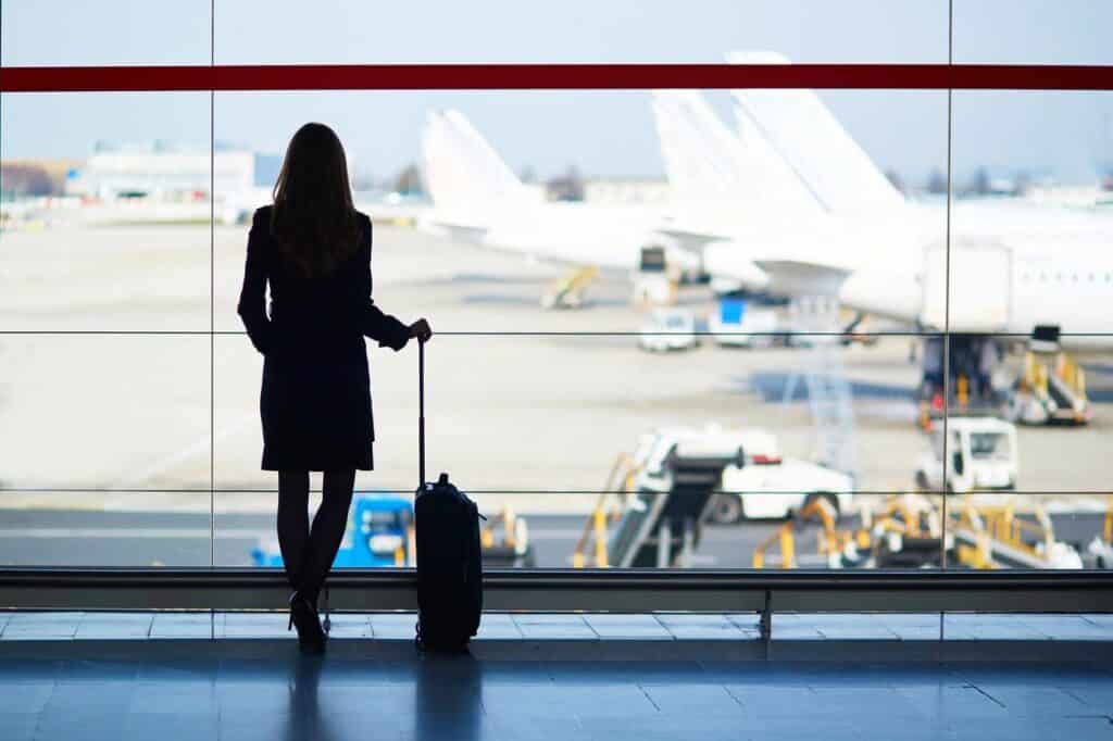 Woman looking outside at the planes at the Dallas airport