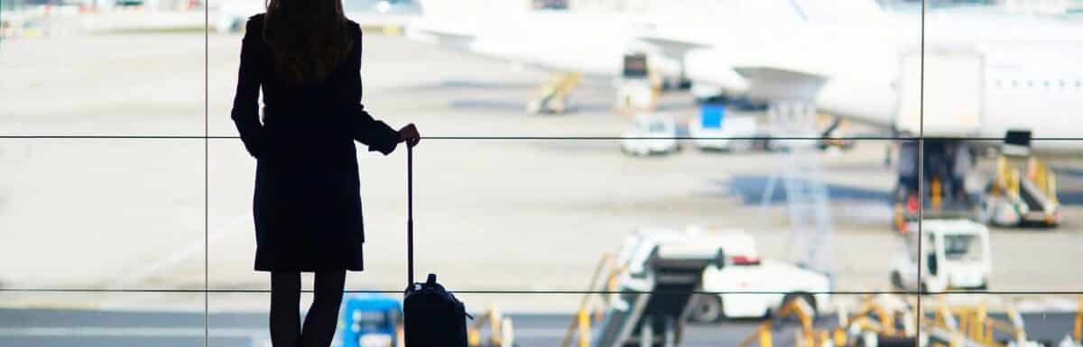 Woman looking outside at the planes at the Dallas airport