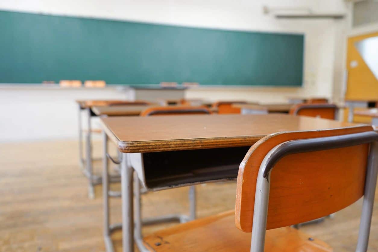 Close up view of a student's desk in a classroom